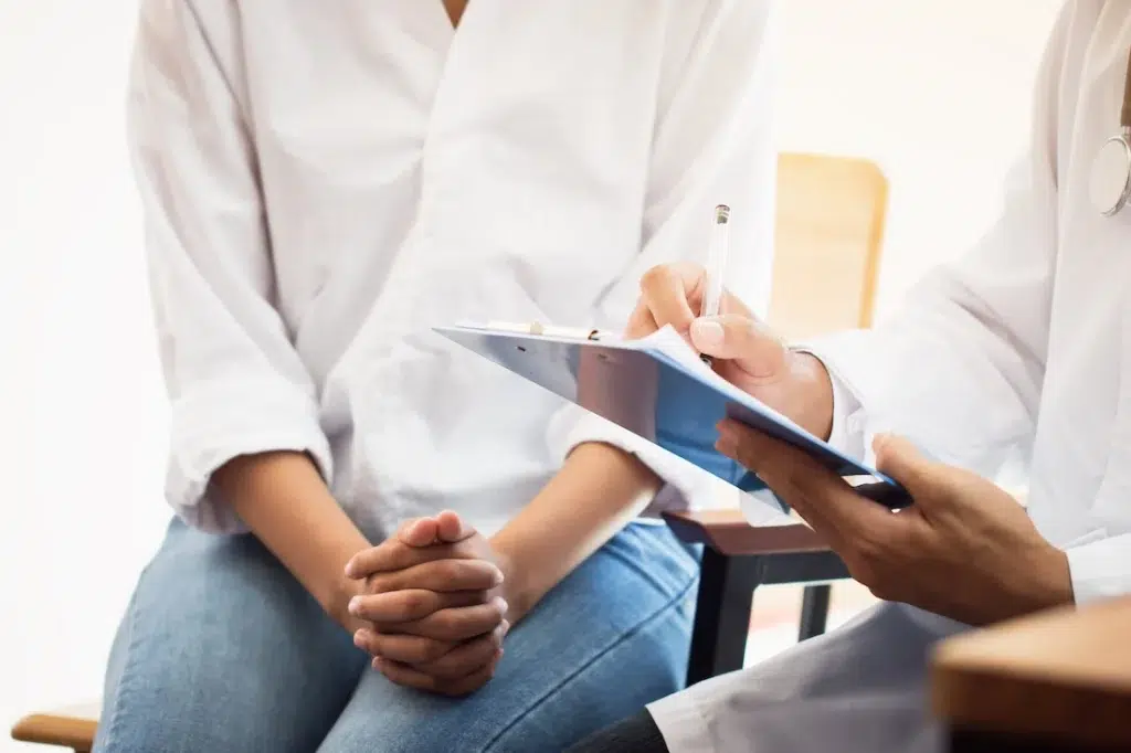 A person talks to a provider about inpatient treatment.